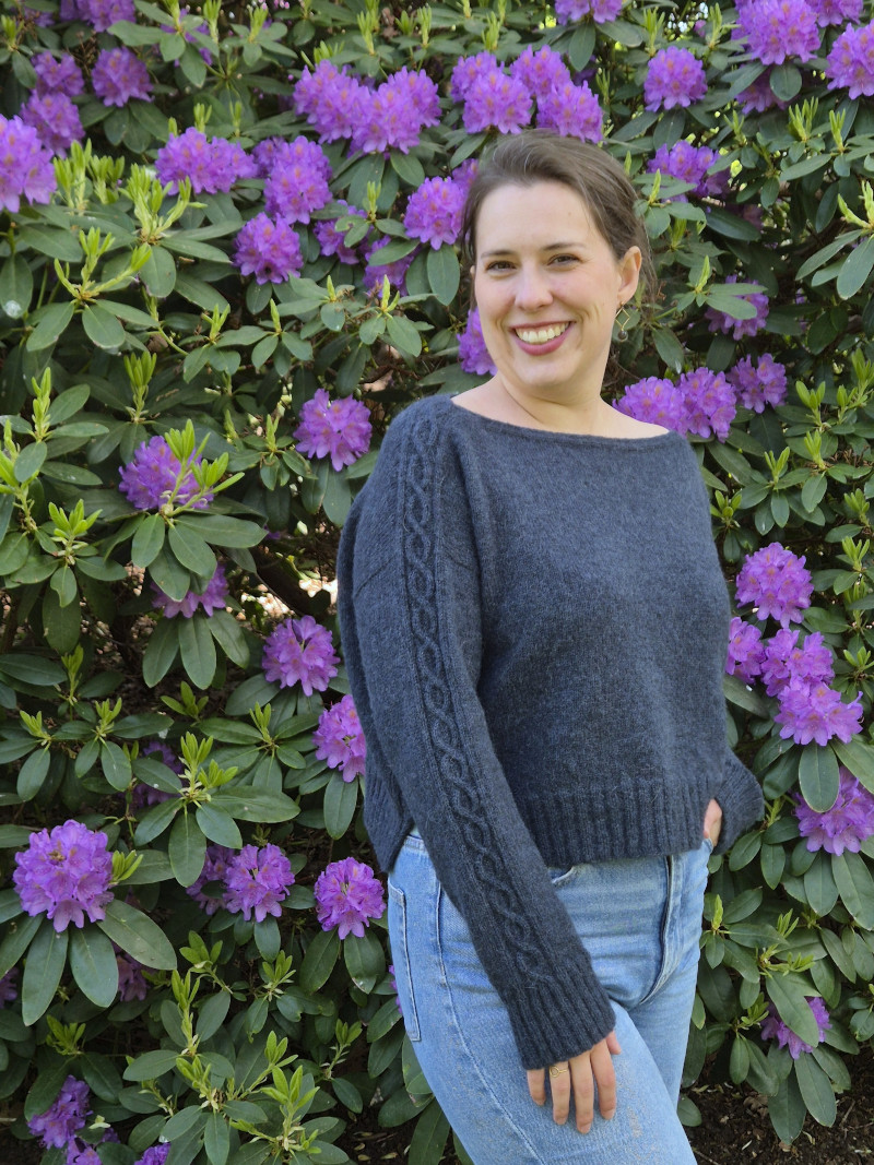 A lightweight, drop shoulder sweater with a boatneck neckline, a relaxed, boxy fit and beautiful cable details that starts on the saddle shoulder and runs all the way down the sleeves.