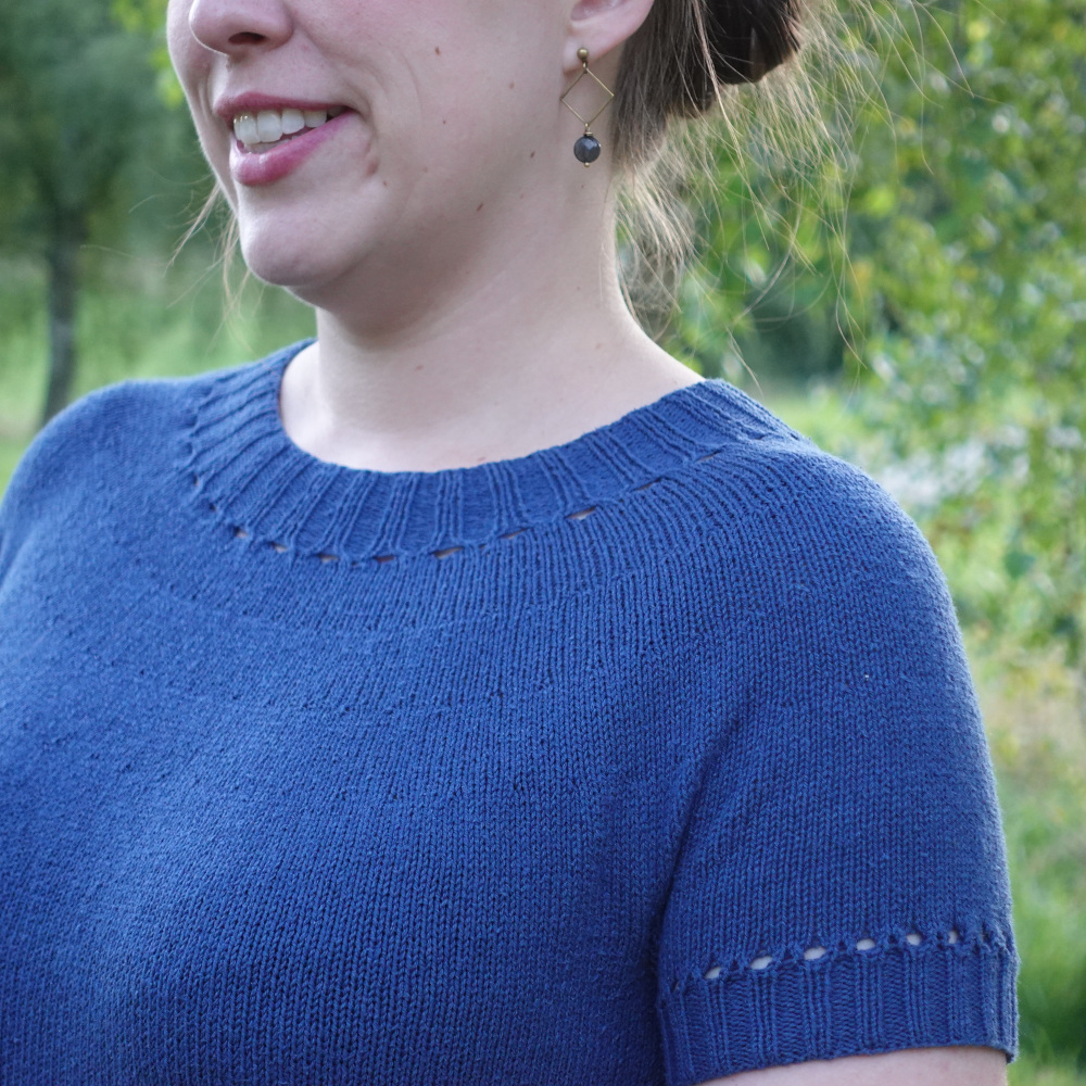 A blue silk tee with a lovely eyelet detail at the edge of the ribbing.