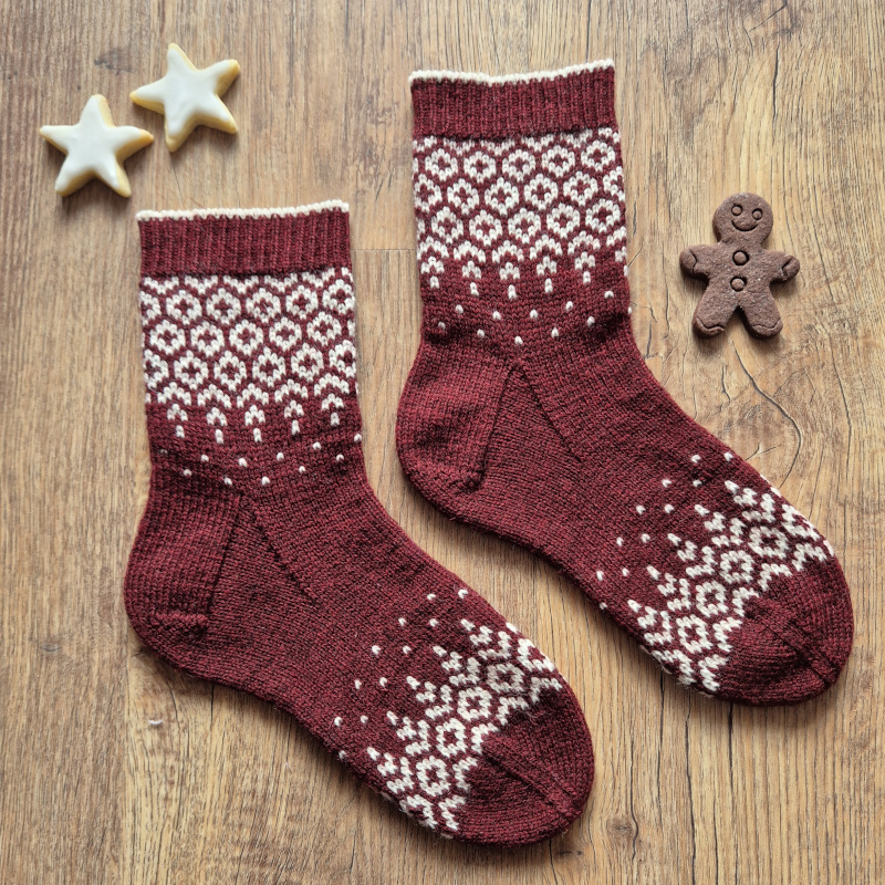 A festive colorwork sock that was inspired by cozy winter days.