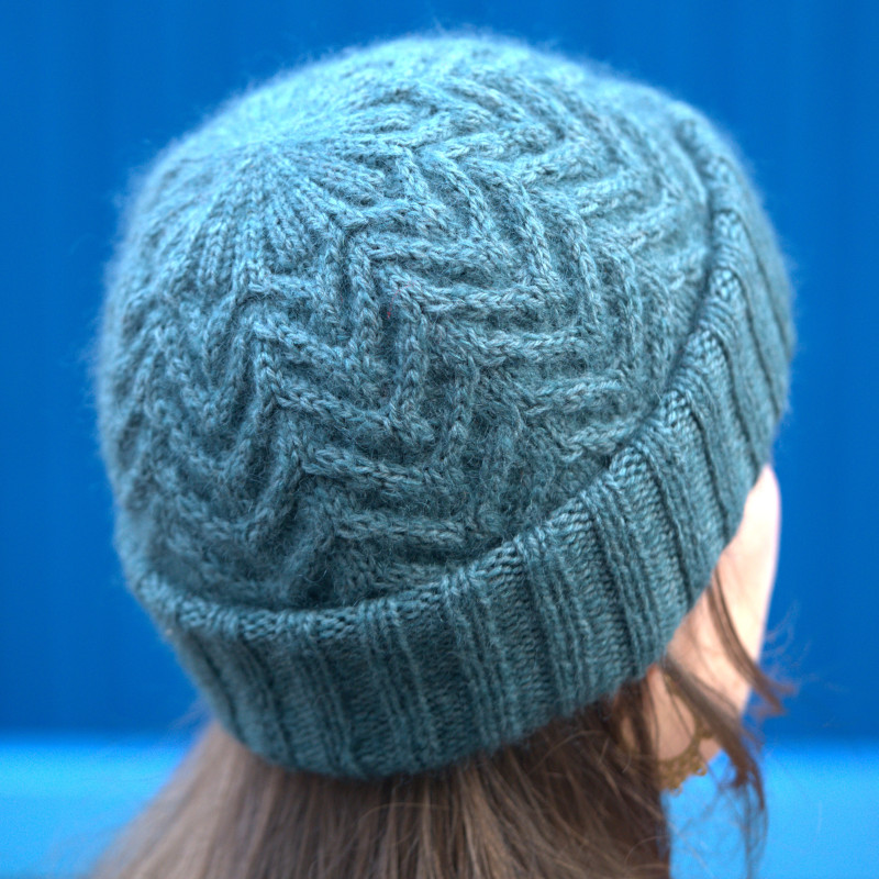 A warm cable hat that comes in two versions.